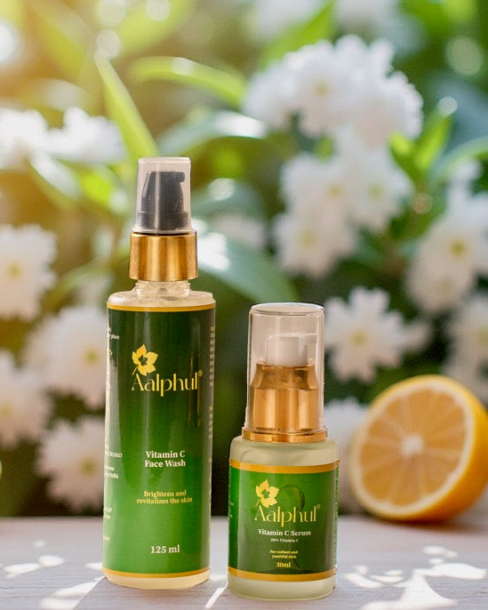 Aalphul Vitamin C Range Combo comprising Vitamin C Face Wash and Vitamin C Serum bottles with a floral background