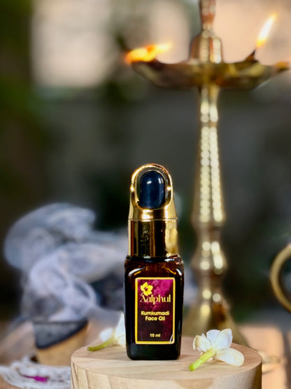 Aalphul Kumkumadi Face Oil display image with an oil lamp in the background