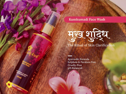 Aalphul Kumkumadi Face Wash bottle on a wooden surface with flowers and text about the product.