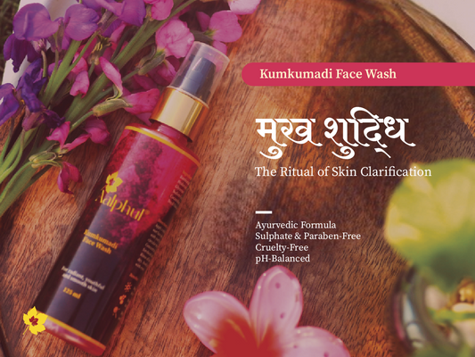 Aalphul Kumkumadi Face Wash bottle on a wooden tray with flowers, text about product features.