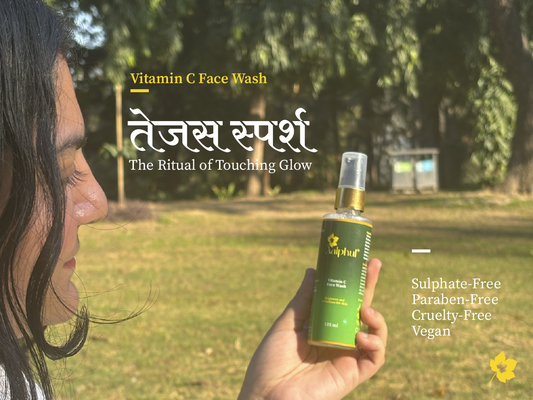 Person holding a bottle of Aalphul Vitamin C Face Wash listing the chemical free features with a natural background