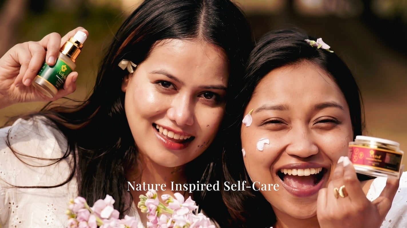 Two women smiling, one applying cream to her face with an Aalphul Skincare product in the foreground, labeled 'Nature Inspired Self-Care'.