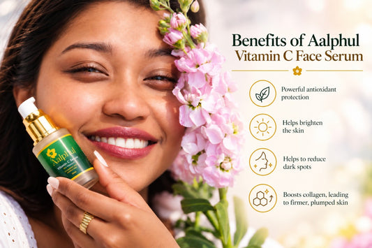 A smiling woman holds a bottle of Aalphul Vitamin C Face Serum next to pink flowers, with text on the right listing benefits such as antioxidant protection and brightening the skin.