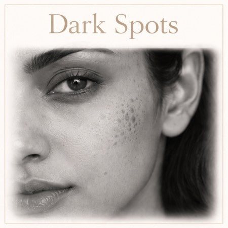 Close-up of a person's face with dark spots on a white background